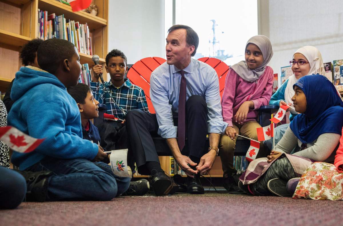 Canada’s federal Finance Minister Bill Morneau takes part in the pre-budget ceremony of putting on new shoes at the Nelson Mandela Park Public School in Toronto, Monday March 20, 2017.