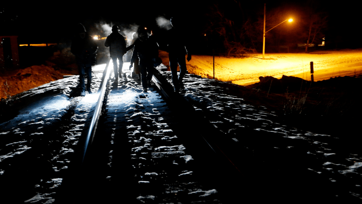 Asylum seekers from Somalia cross into Canada illegally from the United States by walking down a train track into the town of Emerson, Man., early Sunday morning, Feb. 26, 2017. 