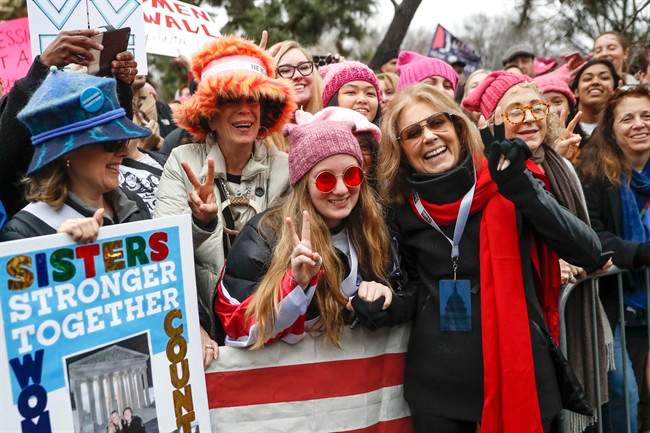 In this Jan. 21, 2017 file photo, Gloria Steinem, center right, greets protesters at the barricades before speaking at the Women's March on Washington during the first full day of Donald Trump's presidency, in Washington.