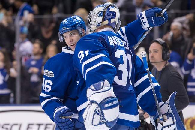 Toronto Maple Leafs' Mitchell Marner (16) celebrates with Toronto Maple Leafs goalie Frederik Andersen after their 4-2 win over the Philadelphia Flyers following NHL hockey action, in Toronto on Thursday, March 9, 2017.