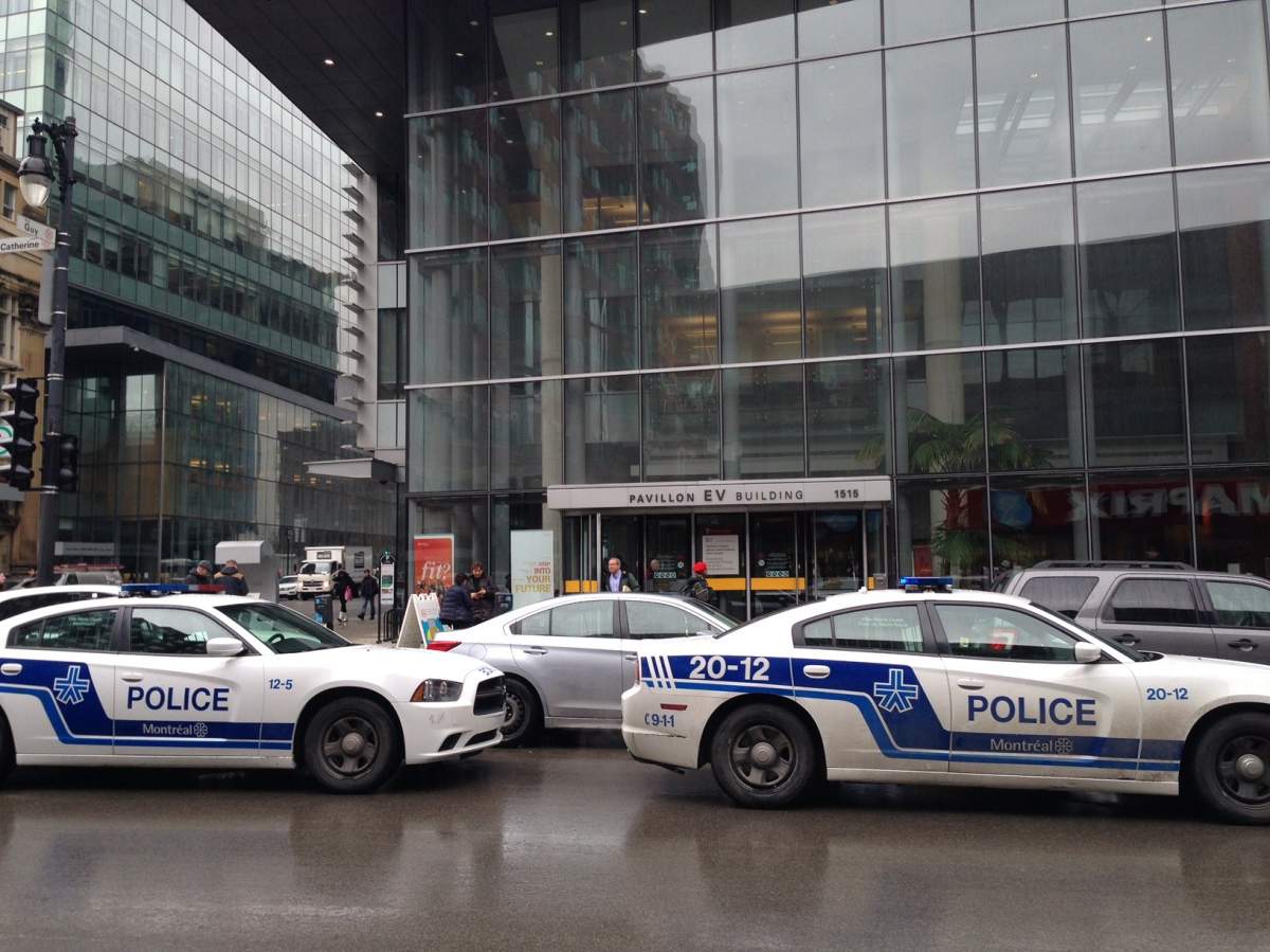 Montreal police cruisers stationed outside Concordia's EV building as officers investigate a bomb threat, Wednesday, March 1, 2017.