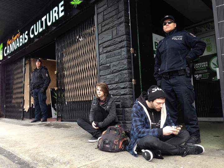 Police raid a Cannabis Culture marijuana dispensary in Vancouver, B.C. on March 9, 2017.