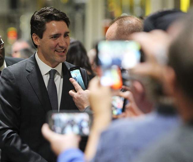 Prime Minister Justin Trudeau greets employees at the Ford Essex Engine Plant in Windsor, Ont. on Thursday, March 30, 2017. 