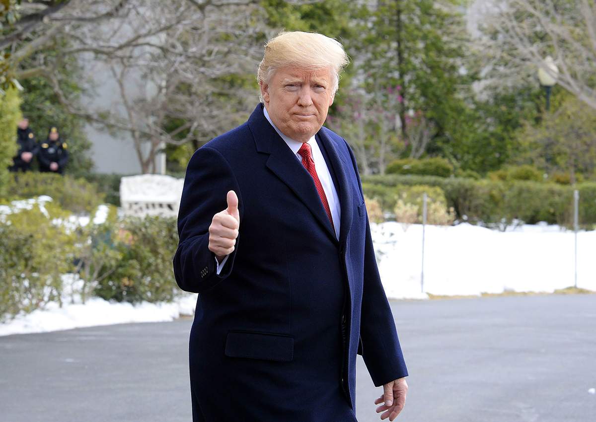 Donald Trump walks on the South Lawn of the White House toward Marine One as he departs the White House.