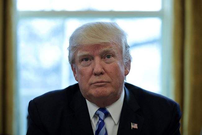 U.S. President Donald Trump talks to journalists at the Oval Office of the White House in Washington, March 24, 2017. 