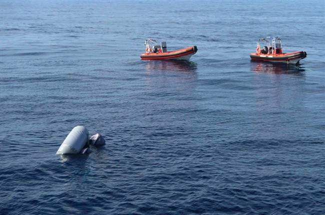 FILE -- In this photo released on Friday, March 24, 2017 a sunken rubber boat in the Mediterranean Sea off the Libyan coast, during a search and rescue operation by Spanish NGO Proactiva Open Arms.