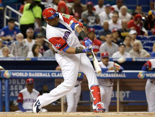Dominican Republic's Nelson Cruz hits a double against Canada during the second inning in a first-round game of the World Baseball Classic, Thursday, March 9, 2017, in Miami.