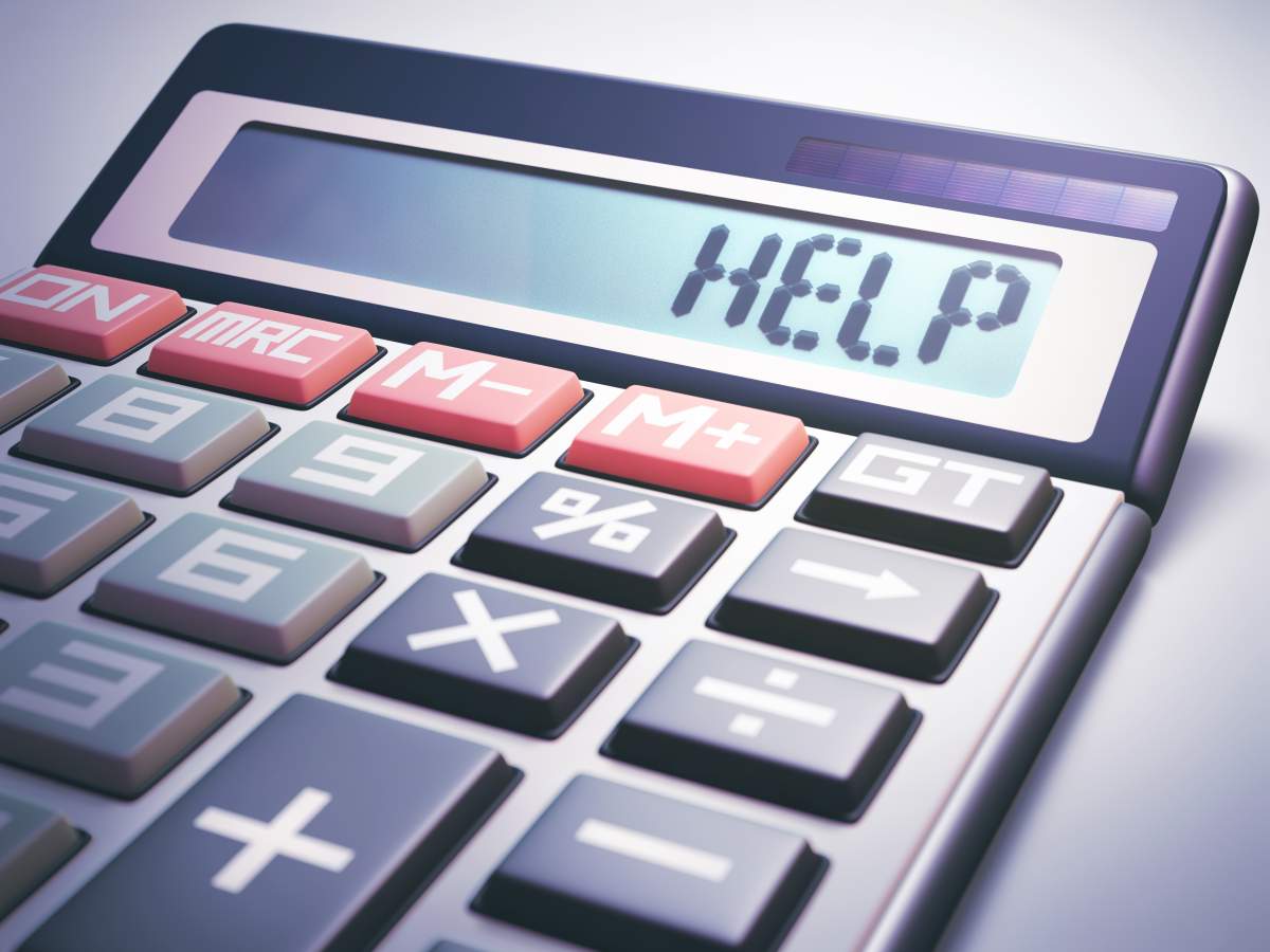 Solar calculator showing on the digital display the word “HELP”.