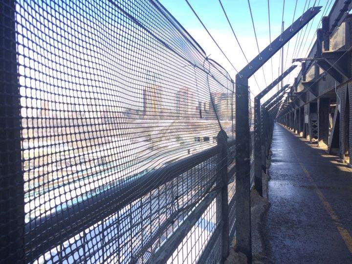 Temporary mesh fencing covers a gaping hole in the High Level Bridge suicide barriers Wednesday, March 15, 2017. 
