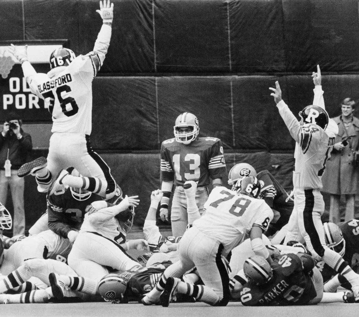 Edmonton Eskimos Larry Highbaugh (13) watches as the Ottawa Rough Riders celebrate scoring the first touchdown during CFL Grey Cup action in Montreal on Nov. 22, 1980.