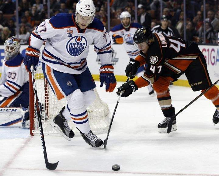 Edmonton Oilers defenseman Oscar Klefbom (77), of Sweden, and Anaheim Ducks defenseman Hampus Lindholm (47), of Sweden, vie for the puck during the second period of an NHL hockey game in Anaheim, Calif., Wednesday, March 22, 2017. 