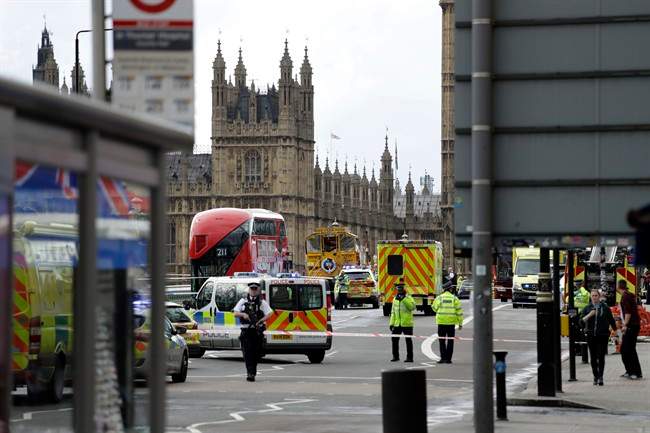 Police secure the area close to the Houses of Parliament in London, Wednesday, March 22, 2017. 