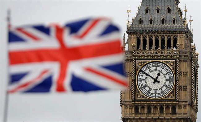 British flag waves in front of the Elizabeth Tower at Houses of Parliament in March.