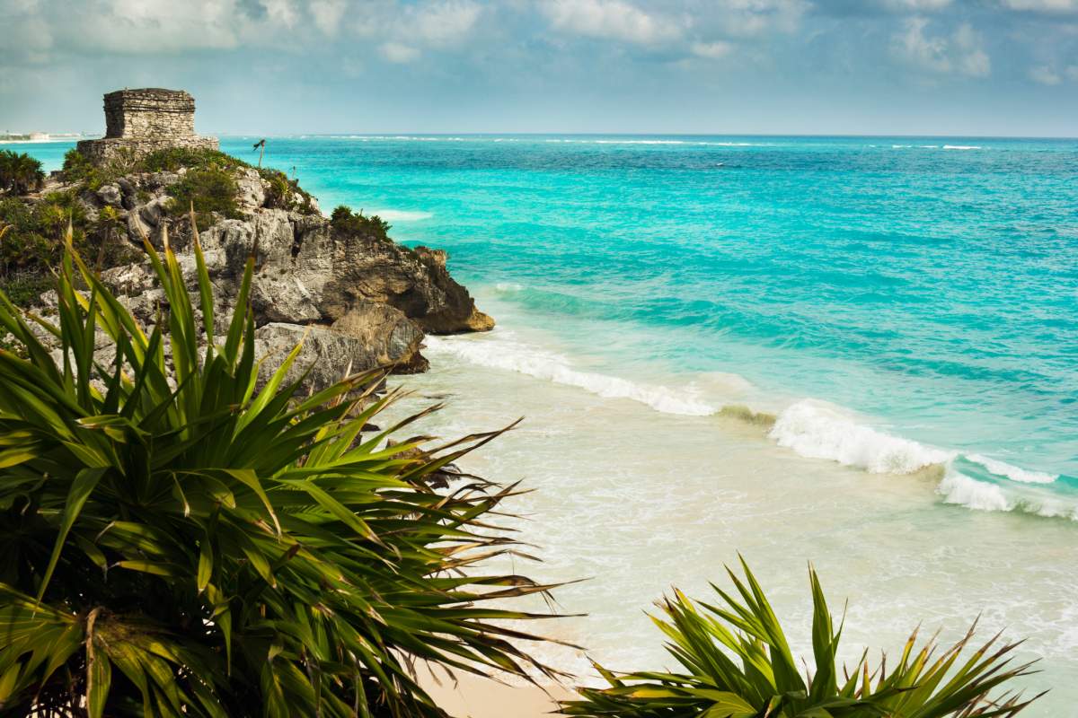 View of the Mayan Ruins at Tulum, overlooking the aqua blue water of the Caribbean Sea.