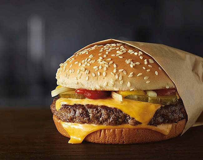 McDonald's Canada says it will return to sourcing only Canadian beef in September.