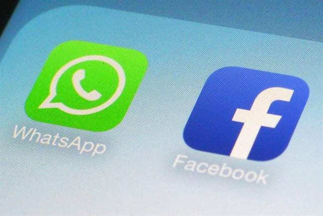 WhatsApp and Facebook app icons on a smartphone in New York.