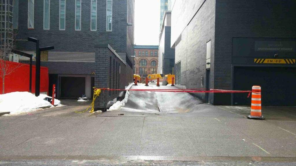 An alleyway just off Drummond Street, near Montreal's Bell Centre, is closed after the concrete started collapsing, Tuesday, March 21, 2017.