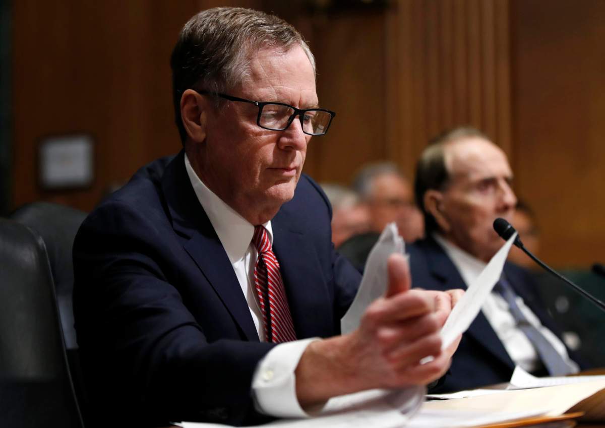 United States Trade Representative-nominee Robert Lighthizer, left, with former Sen Bob Dole, R-Kan., looks at his documents during his confirmation hearing on Capitol Hill in Washington, Tuesday, March 14, 2017. 