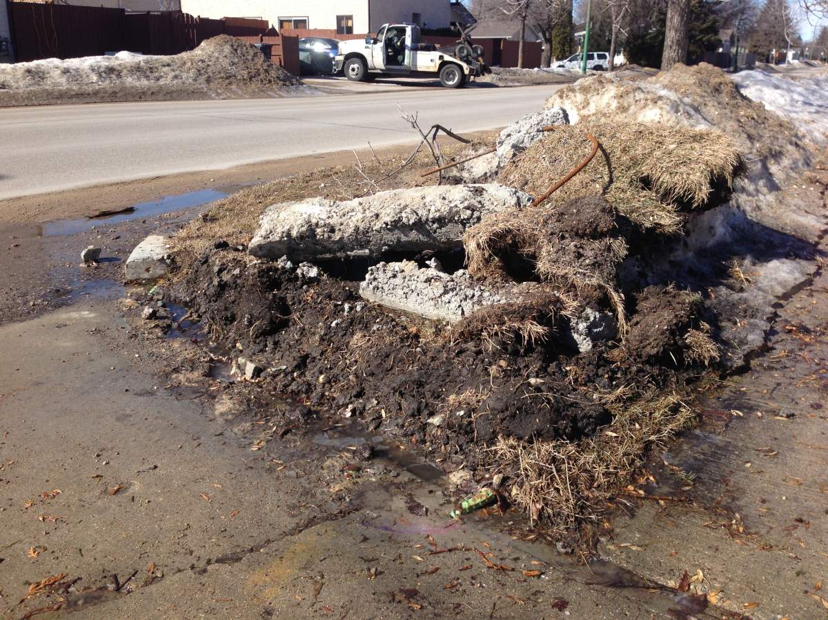 Cement from a curb in North Kildonan is now torn apart and sitting on someones lawn.