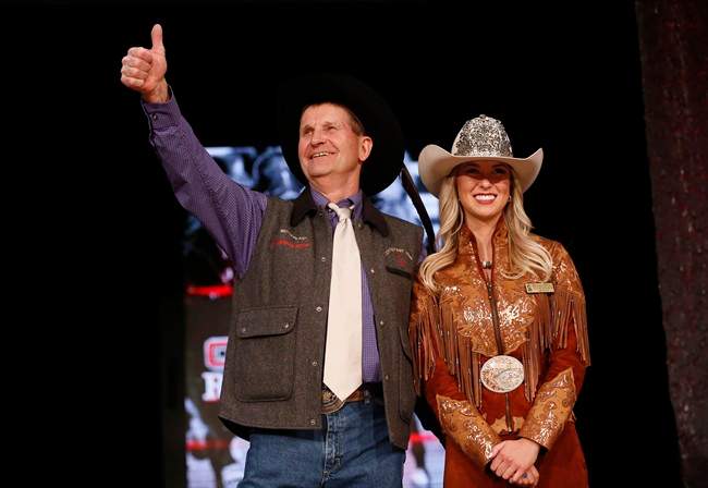 World Champion chuckwagon driver Kelly Sutherland reacts after he was auctioned off during the annual Calgary Stampede Canvas Auction where businesses bid on sponsoring a chuckwagon driver for the upcoming Calgary Stampede in Calgary, Thursday, March 23, 2017.