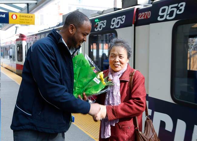 Li Feng Yang thanks CTrain operator Mesfin Tadese at the Centre street CTrain station in Calgary, Tuesday, March 28, 2017. Tadese found the 75-year-old Yang's purse containing $1,300 on a train and had it returned to her.