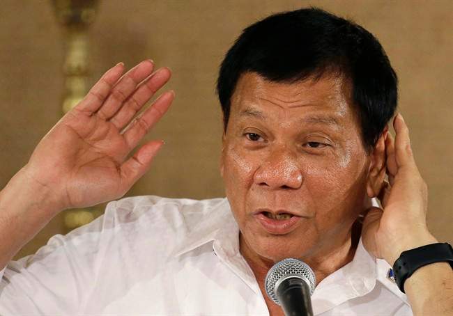In this March 13, 2017 file photo, Philippine President Rodrigo Duterte gestures as he answers questions from reporters during a press conference at the Malacanang presidential palace in Manila, Philippines. 
