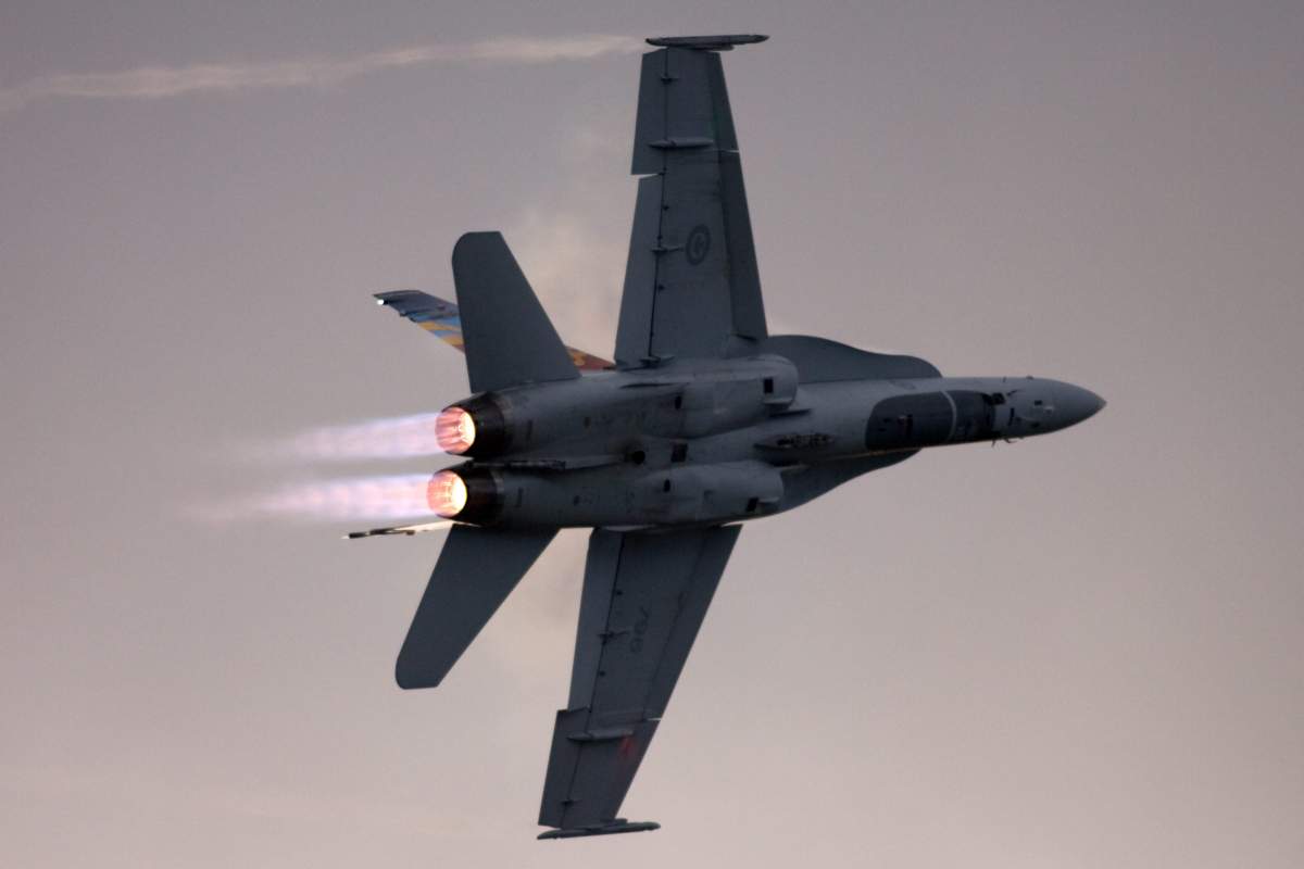 A Canadian Forces CF-18 makes a highspeed afterburner turn at the Great Lakes International Air Show.  