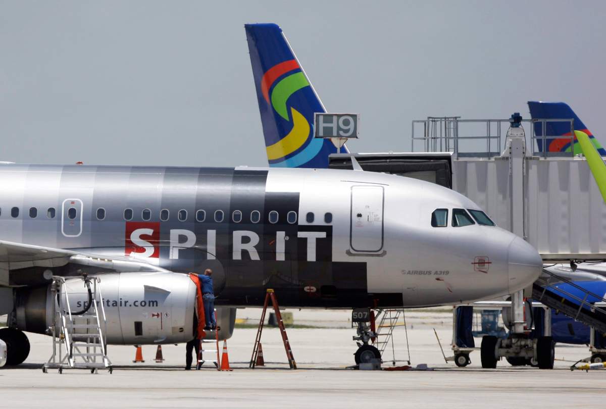 In this file photo taken June 13, 2010, a Spirit Airlines airplane sits on the tarmac at Fort Lauderdale-Hollywood International Airport in Fort Lauderdale, Fla.