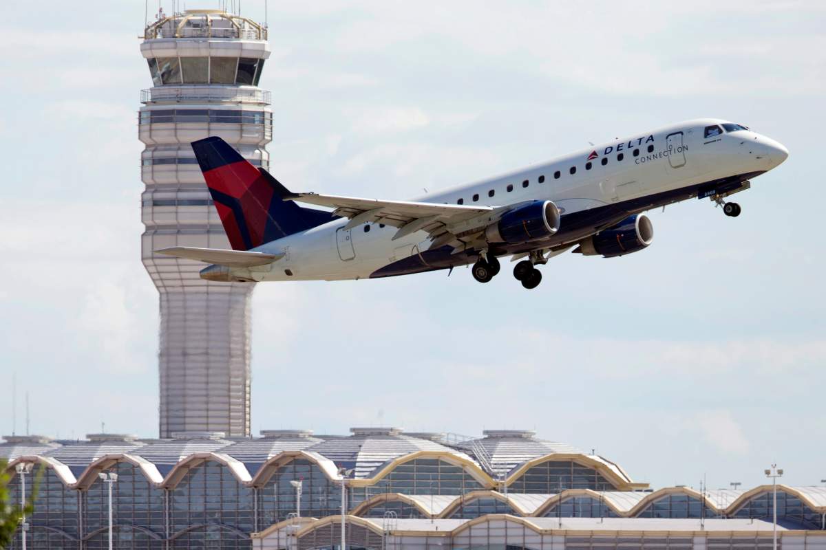 In this July 28, 2014 file photo, a Delta Air Lines jet takes off from Ronald Reagan Washington National Airport in Arlington, Va.