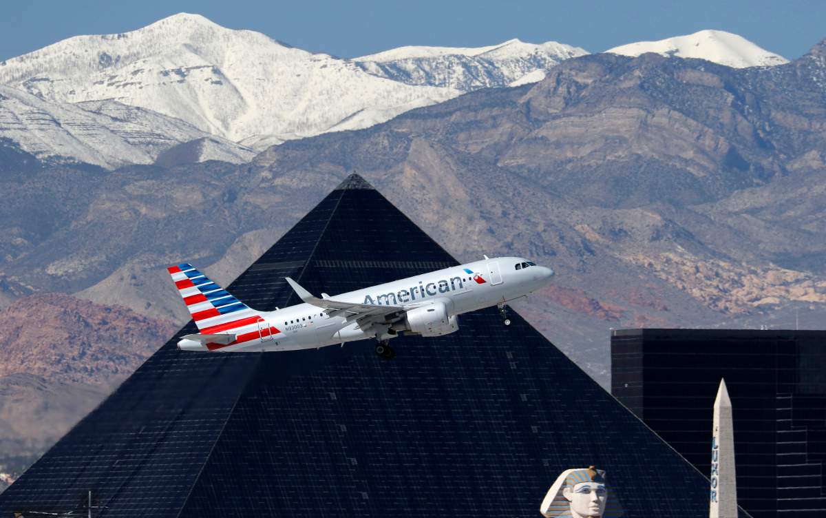 An Airbus A319 (A319-100) jetliner, belonging to American Airlines, passes the Luxor Hotel/Casino on the Las Vegas Strip as it takes off at McCarran International Airport in Las Vegas, Nv., on March 2, 2017.