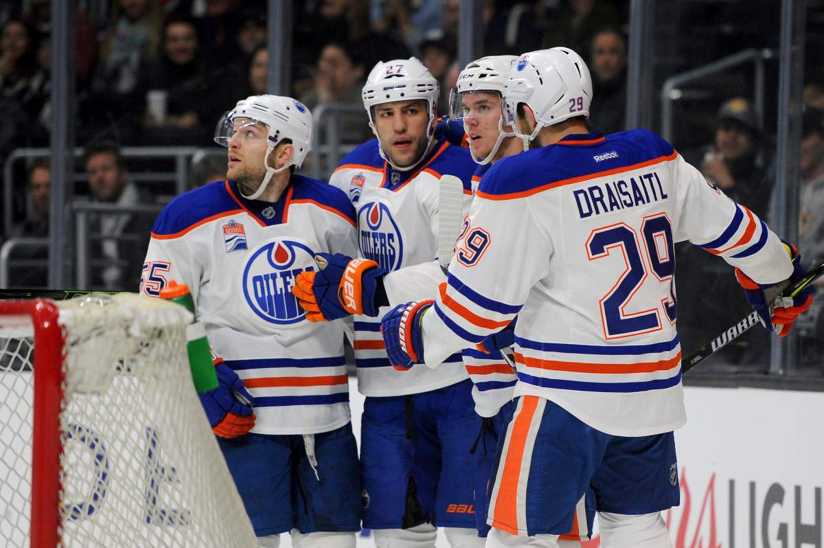 Edmonton Oilers, from left, Mark Letestu, Milan Lucic, Connor McDavid and Leon Draisaitl (29), of Germany, celebrate Lucic’s first-period goal against the Los Angeles Kings during an NHL hockey game, Tuesday, April 4, 2017, in Los Angeles.