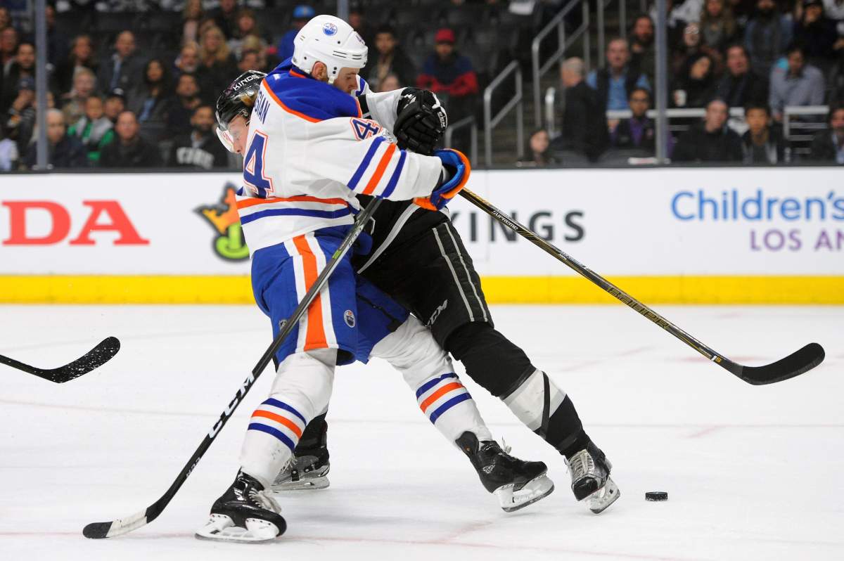 Edmonton Oilers right wing Zack Kassian (44) runs into Los Angeles Kings defenseman Paul LaDue in the first period of an NHL hockey game, Tuesday, April 4, 2017, in Los Angeles.