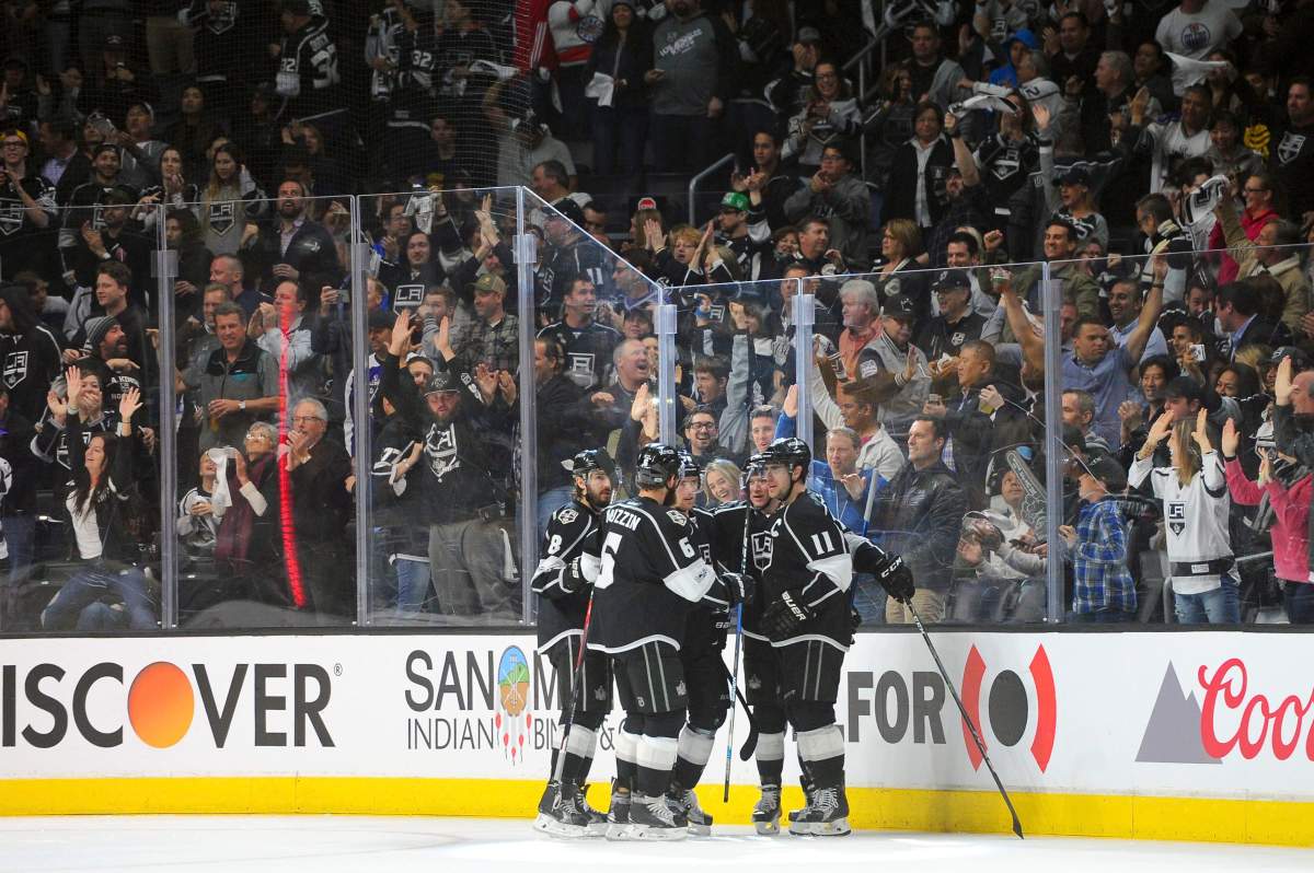 Los Angeles Kings and fans celebrate the third-period goal by left wing Tanner Pearson against Edmonton Oilers during an NHL hockey game, Tuesday, April 4, 2017, in Los Angeles.