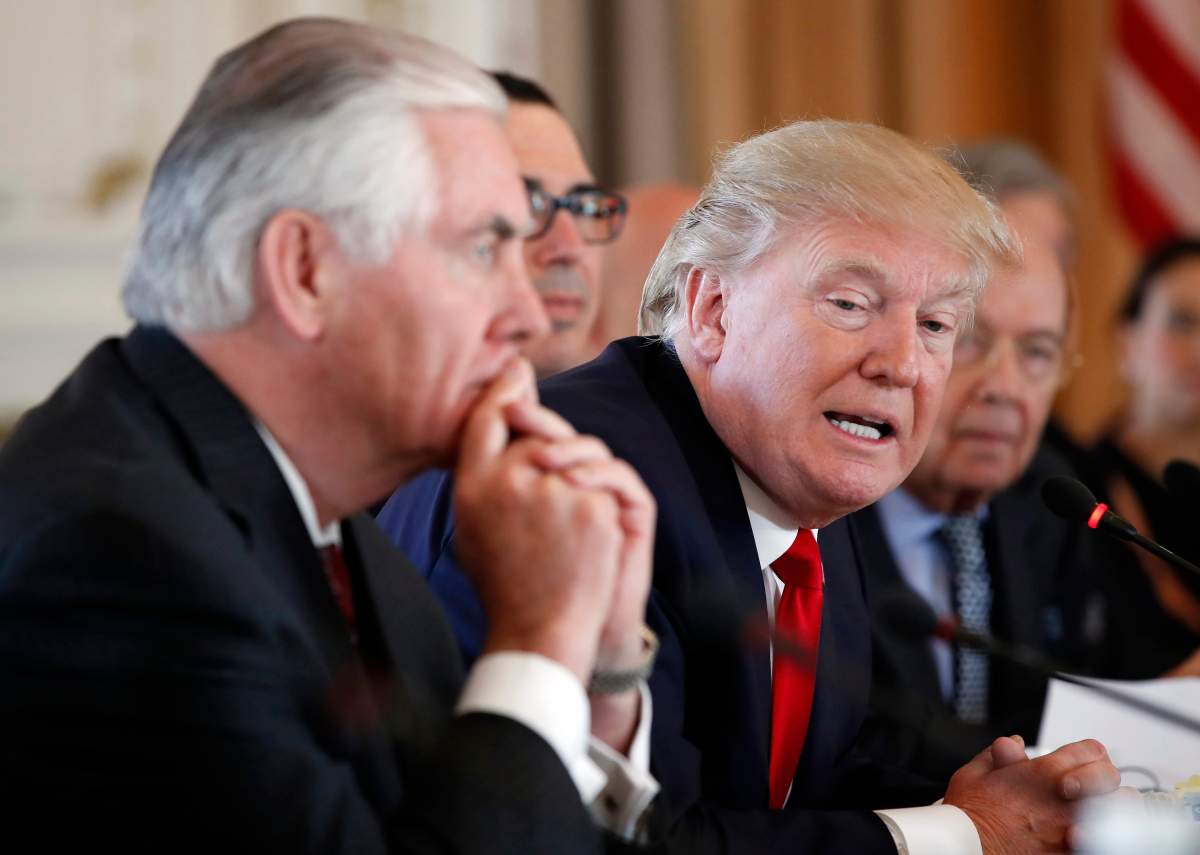 In this April 7, 2017, photo, President Donald Trump, joined by Secretary of State Rex Tillerson, left, speaks during a bilateral meeting with Chinese President Xi Jinping at Mar-a-Lago in Palm Beach, Fla.