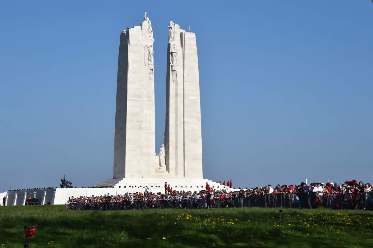 People attend attend the commemorations of the 100th anniversary of the Battle of Vimy Ridge, a World War I battle which was a costly victory for Canada but one that helped shape the former British colony’s national identity, at the WWI Canadian National Vimy Memorial in Vimy, near Arras, northern France, Sunday, April 9, 2017. (Philippe Huguen/Pool Photo via AP)