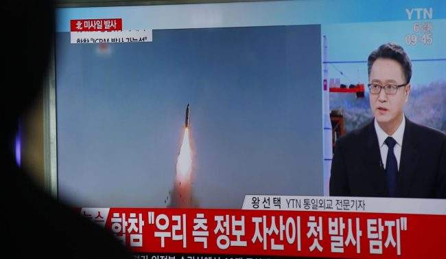 South Koreans watch a television displaying a news broadcast reporting on North Korea test-firing ballistic missiles, at a station in Seoul, South Korea, March 6, 2017.
