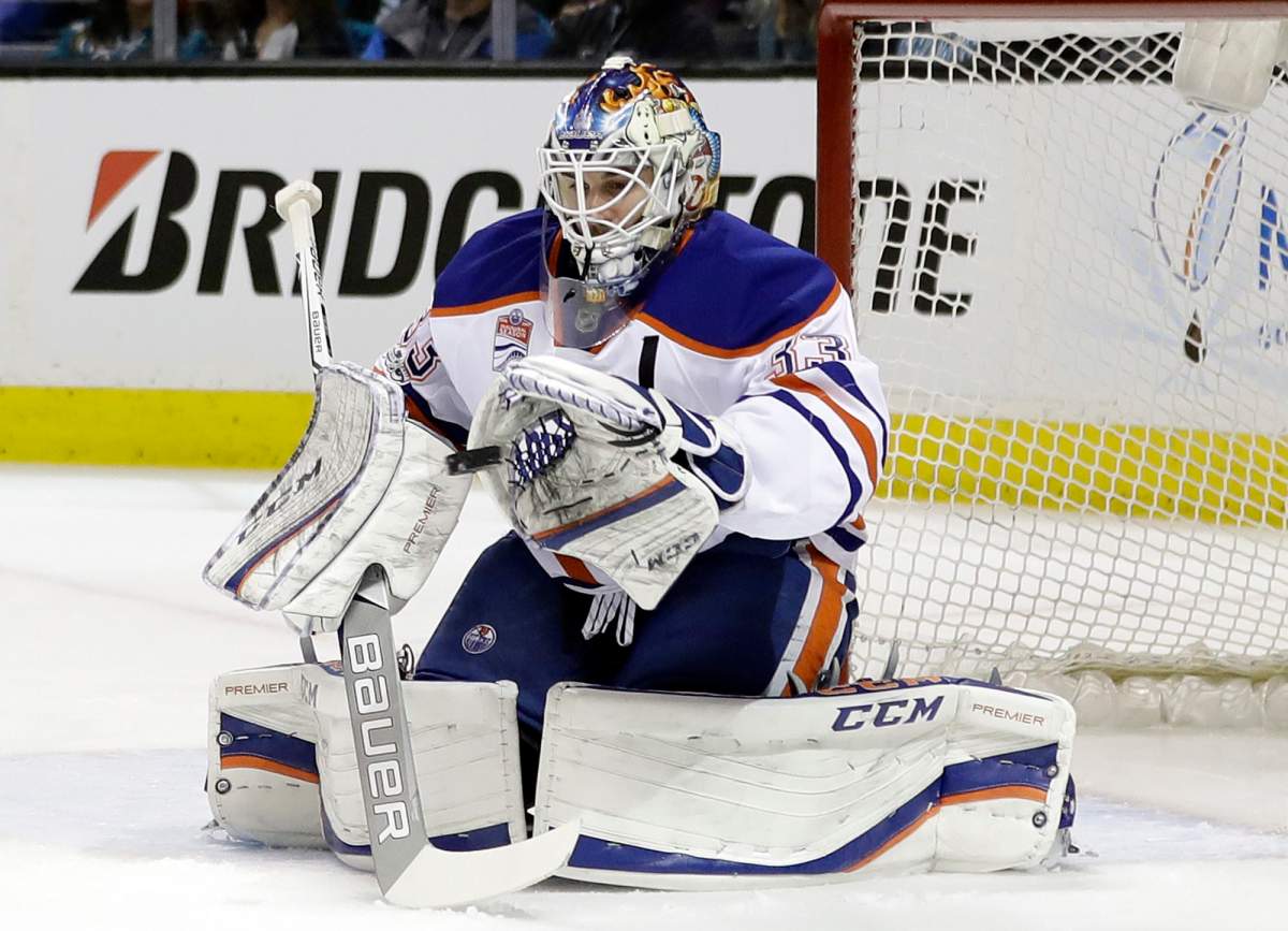 Edmonton Oilers goalie Cam Talbot (33) stops as shot against the San Jose Sharks during the first period in Game 3 of a first-round NHL hockey playoff series Sunday, April 16, 2017, in San Jose, Calif. (AP Photo/Marcio Jose Sanchez)
