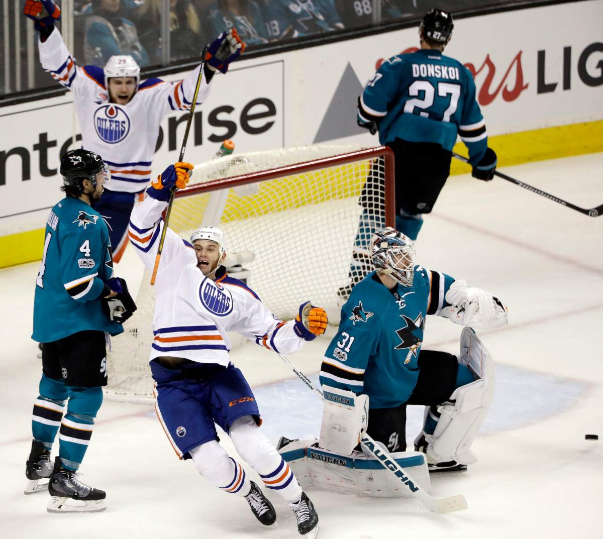 Edmonton Oilers’ Zack Kassian, bottom center, celebrates after scoring against the San Jose Sharks during the third period in Game 3 of a first-round NHL hockey playoff series Sunday, April 16, 2017, in San Jose, Calif. (AP Photo/Marcio Jose Sanchez)