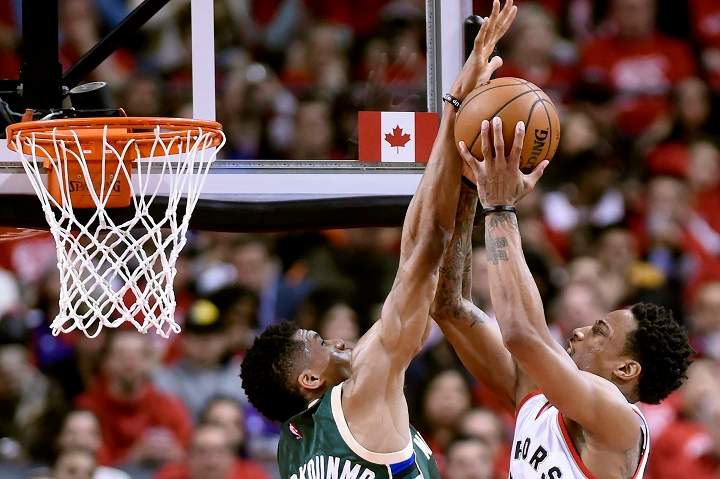 Toronto Raptors guard DeMar DeRozan (10) drives to the net against Milwaukee Bucks forward Giannis Antetokounmpo (34) during second half NBA playoff basketball action in Toronto on Tuesday, April 18, 2017.