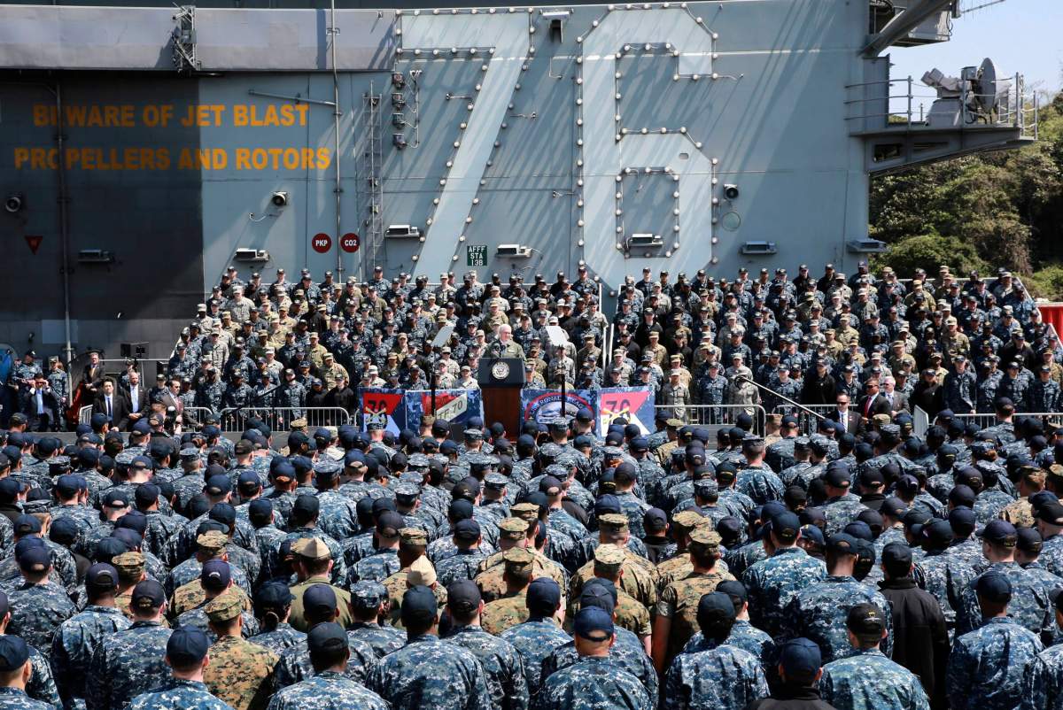 U.S. Vice President Mike Pence, center, speaks to U.S. servicemen and Japanese Self-Defense Forces personnel on the flight deck of U.S. navy nuclear-powered aircraft carrier USS Ronald Reagan, at the U.S. Navy’s Yokosuka base in Yokosuka, south of Tokyo, Wednesday, April 19, 2017. Japan is drawing up emergency responses in case of a North Korea missile strike. A number of municipalities are testing community alarm systems and planning evacuation drills as concerns run high around U.S. military bases. Both Japan and South Korea are home to tens of thousands of U.S. troops.