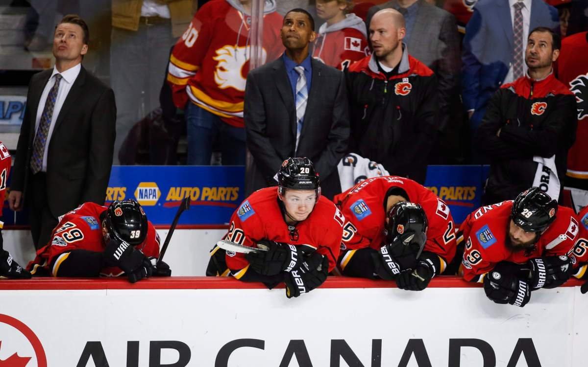 Calgary Flames' players watch the dying seconds of their loss to the Anaheim Ducks during third period NHL hockey round one playoff action in Calgary, Wednesday, April 19, 2017. THE CANADIAN PRESS/Jeff McIntosh.