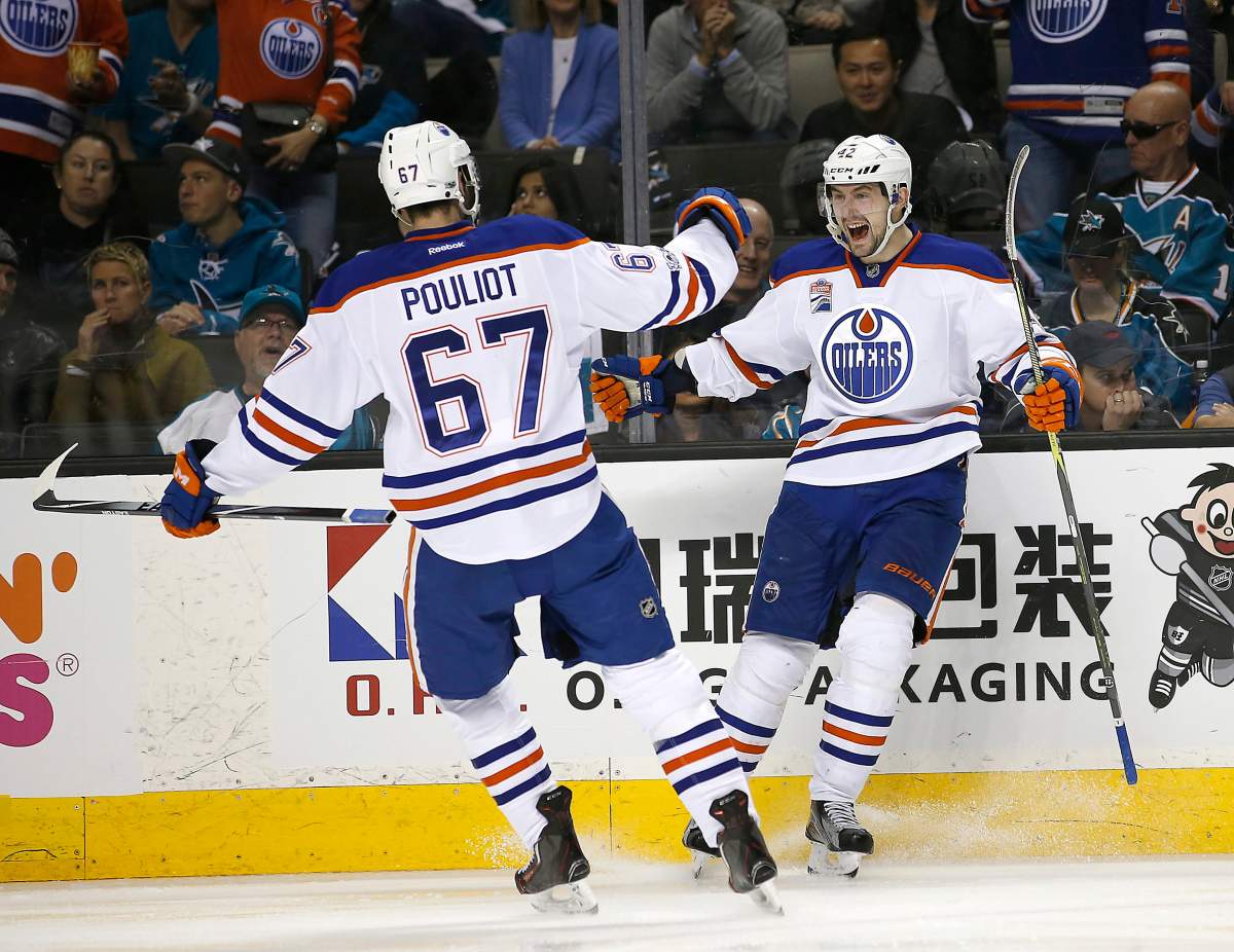 Edmonton Oilers left wing Anton Slepyshev (42) celebrates after scoring a goal with teammate Benoit Pouliot (67) during the second period against the San Jose Sharks in Game 6 of a first-round NHL hockey playoff series Saturday, April 22, 2017, in San Jose, Calif. (AP Photo/Tony Avelar)