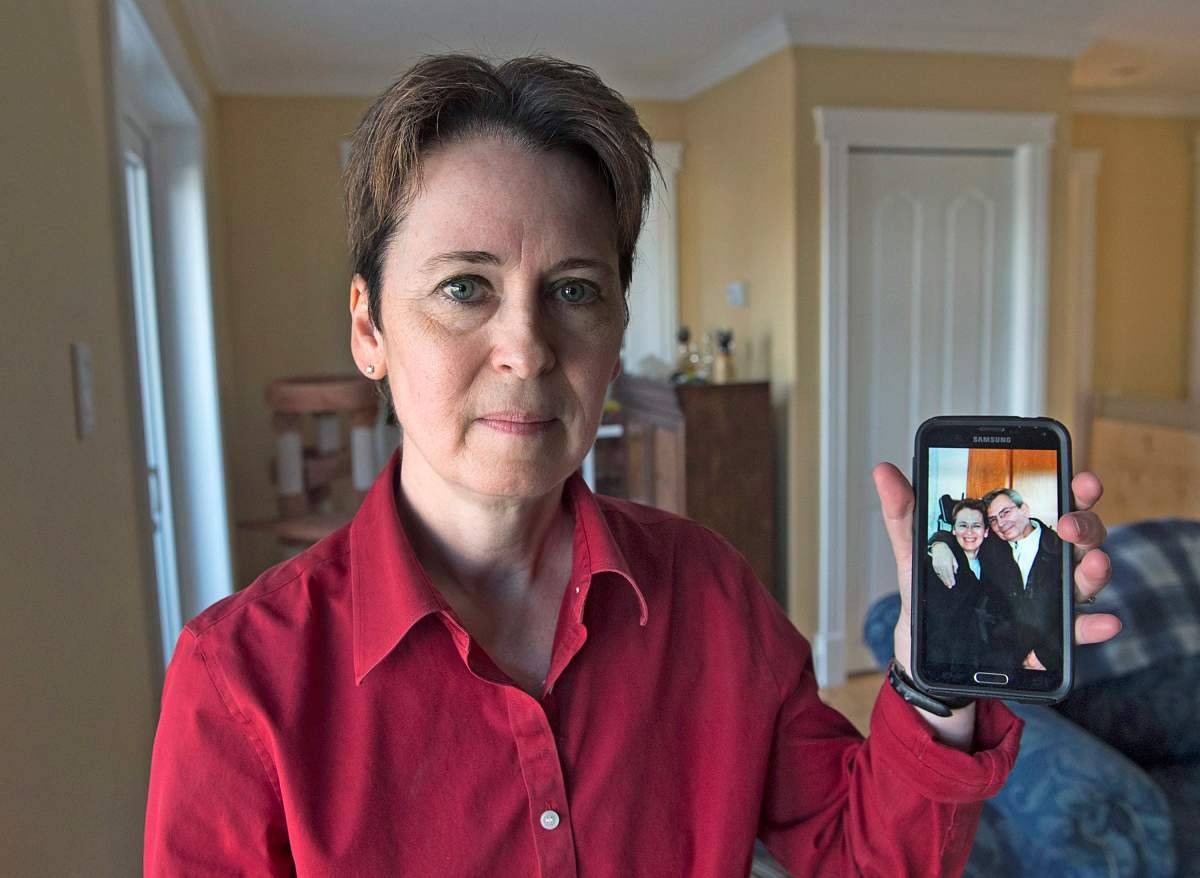 Kim D'Arcy displays an image of her late husband Jack Webb at her home in Bedford, N.S. on Thursday, April 13, 2017.