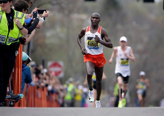 Geoffrey Kirui, of Kenya, leads Galen Rupp, of the United States, and the rest of the field along the course of the 121st Boston Marathon on Monday, April 17, 2017, in Brookline, Mass.