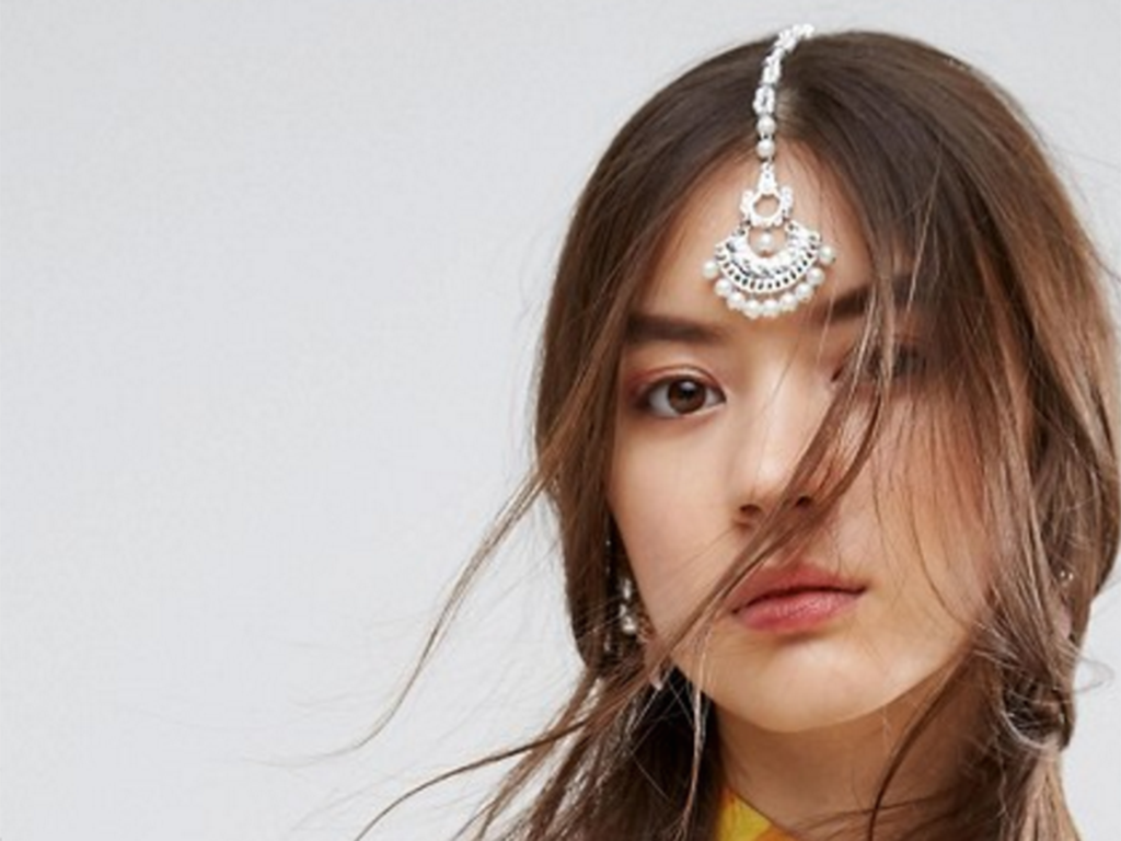 U.K. retailer Asos receives criticism for calling a South Asian tikka a "chandelier hair clip.".