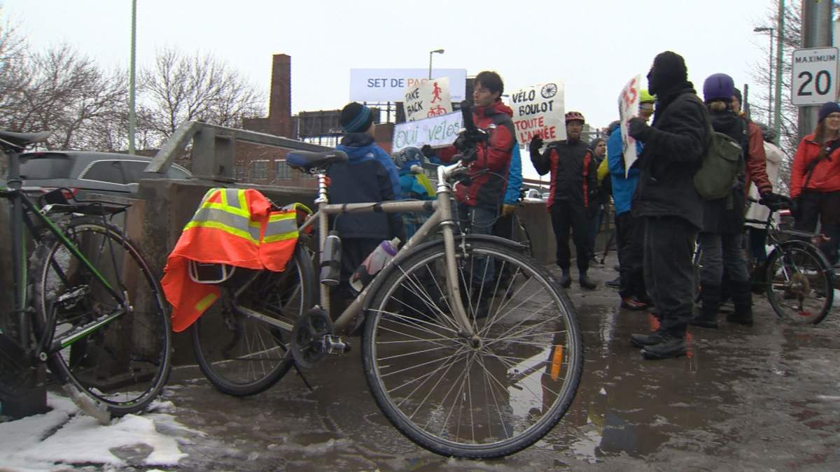 In this 2017 file photo, protesters on the Jacques Cartier Bridge want access to safe modes of active transportation all year. Following a pilot-project the bridge corporation announced the bike path would not be open for the 2018 winter season. Thursday, Oct. 11, 2018.