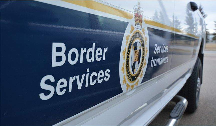 A 25-year-old man is facing multiple charges after RCMP say he injured an officer while allegedly smuggling migrants across the Canada-U.S. border in Quebec.