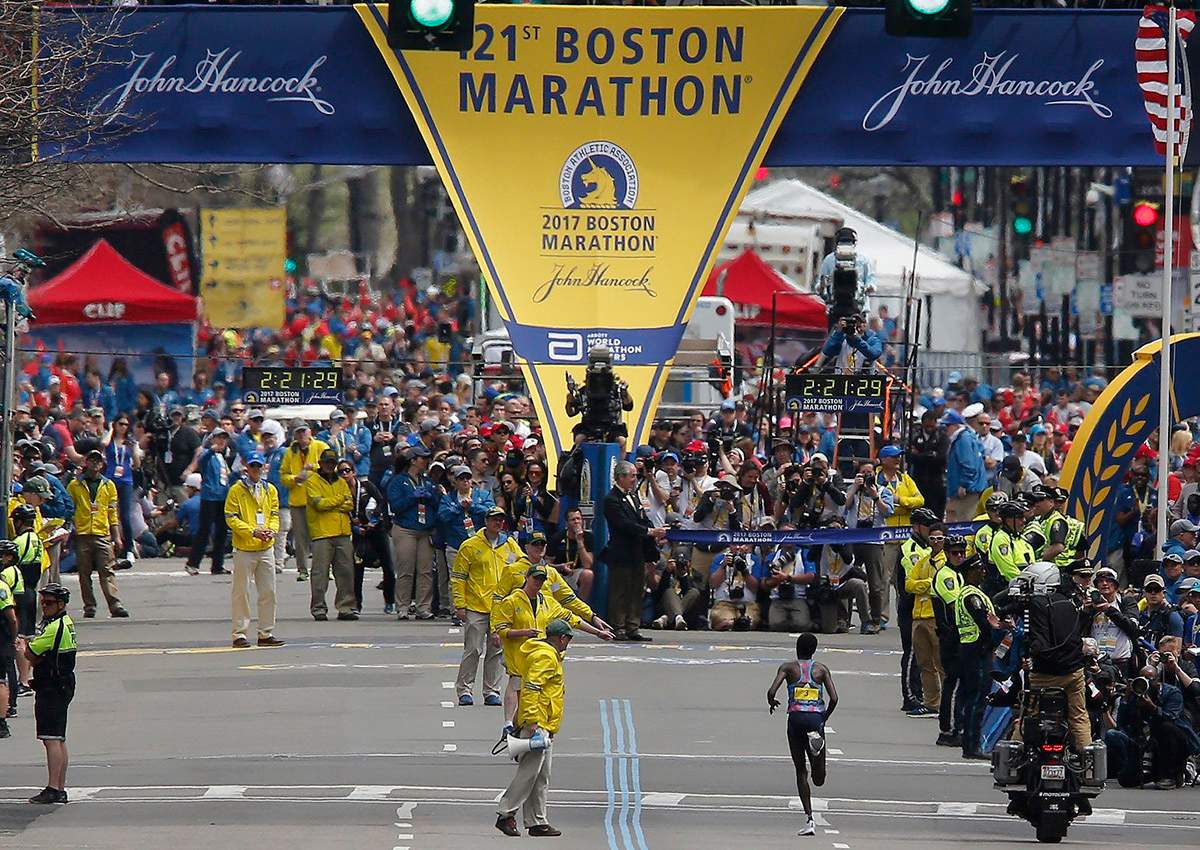 Edna Kiplagat of Kenya runs to the finish line to win the Women’s Division of the 121st Boston Marathon.