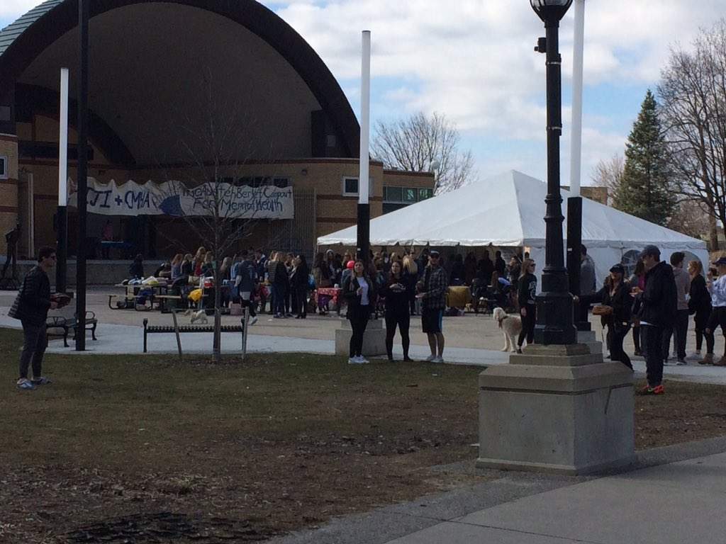 Phi Gamma Delta speaks with Londoners at Victoria Park during their 24-hour campout on April 1, 2017.