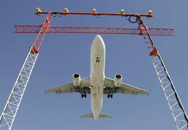 An Air Canada flight makes its final approach as it lands at Pearson International Airport in Toronto. 